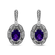 Bids.com .925 Sterling Silver Diamond Accent and 8x6mm Purple Oval Amethyst Stud Earrings (I-J Color, I1-I2 Clarity) Earrings
