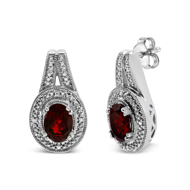 Bids.com .925 Sterling Silver Diamond Accent and 8x6mm Red Oval Garnet Stud Earrings (I-J Color, I1-I2 Clarity) Earrings