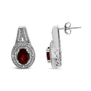 Bids.com .925 Sterling Silver Diamond Accent and 8x6mm Red Oval Garnet Stud Earrings (I-J Color, I1-I2 Clarity) Earrings
