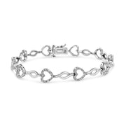 Bids.com .925 Sterling Silver 1/4 Cttw Round-Cut Diamond Alternating Heart and Leaf Link Bracelet (I-J Color, I3 Clarity) - Size 7.25" Bracelets