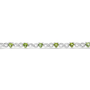 Bids.com .925 Sterling Silver 1.00 Cttw Diamond and 4.00mm Lab Created Green Heart-Shaped Peridot Infinity Link Bracelet (I-J Color, I2-I3 Clarity) - 7.25" Bracelets