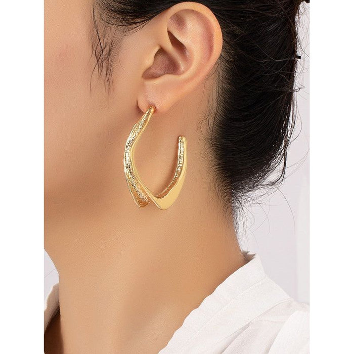 Twisted metal hoop earrings