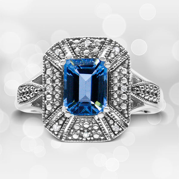 Bids.com .925 Sterling Silver Diamond Accent and 8X6 mm Emerald-Shape Blue Topaz Ring (I-J Color, I2-I3 Clarity) - Ring Size 7 Rings