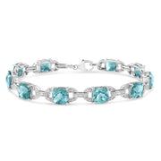 Bids.com .925 Sterling Silver 7x7 mm Cushion Cut Blue Topaz and 1/20 cttw Round Cut Diamond Fashion Tennis Bracelet (I-J Color, I1-I2 Clarity) - 7" Bracelets