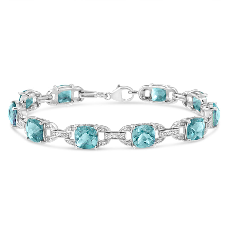 Bids.com .925 Sterling Silver 7x7 mm Cushion Cut Blue Topaz and 1/20 cttw Round Cut Diamond Fashion Tennis Bracelet (I-J Color, I1-I2 Clarity) - 7" Bracelets
