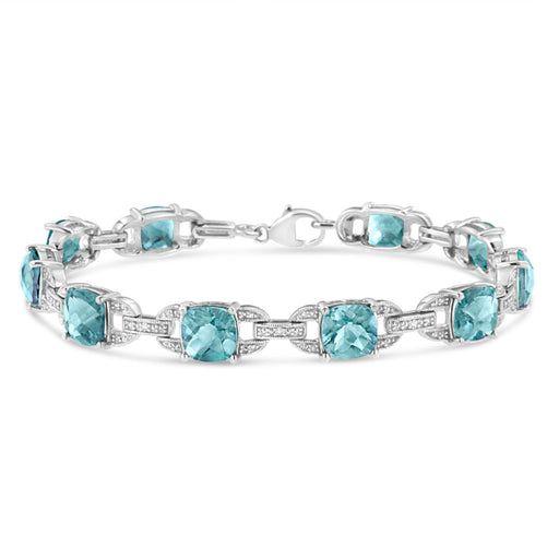 Bids.com .925 Sterling Silver 7x7 mm Cushion Cut Blue Topaz and 1/20 cttw Round Cut Diamond Fashion Tennis Bracelet (I-J Color, I1-I2 Clarity) - 7" Bracelets