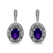 Bids.com .925 Sterling Silver Diamond Accent and 8x6mm Purple Oval Amethyst Stud Earrings (I-J Color, I1-I2 Clarity) Earrings
