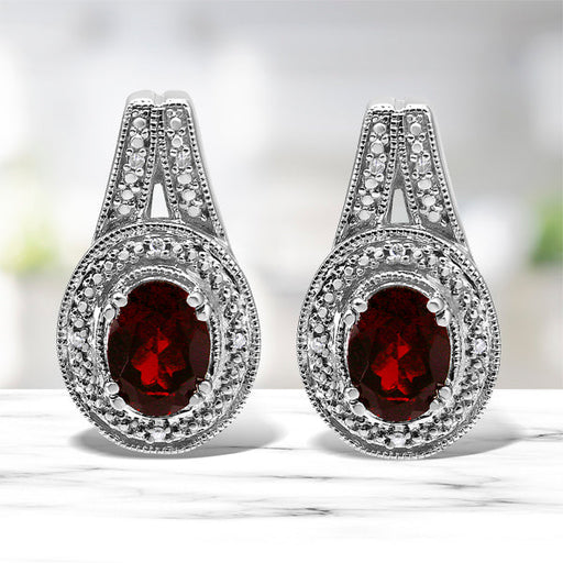 Bids.com .925 Sterling Silver Diamond Accent and 8x6mm Red Oval Garnet Stud Earrings (I-J Color, I1-I2 Clarity) Earrings