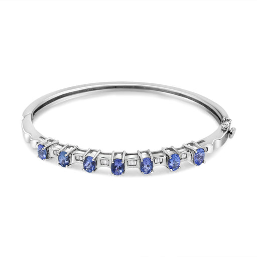 Bids.com 14K White Gold 5 MM Oval Blue Tanzanite and 1/4 Cttw Diamond Bangle (H-I Color, VS2-SI1 Clarity) - Fits wrists up to 7 1/2 Inches Bracelets