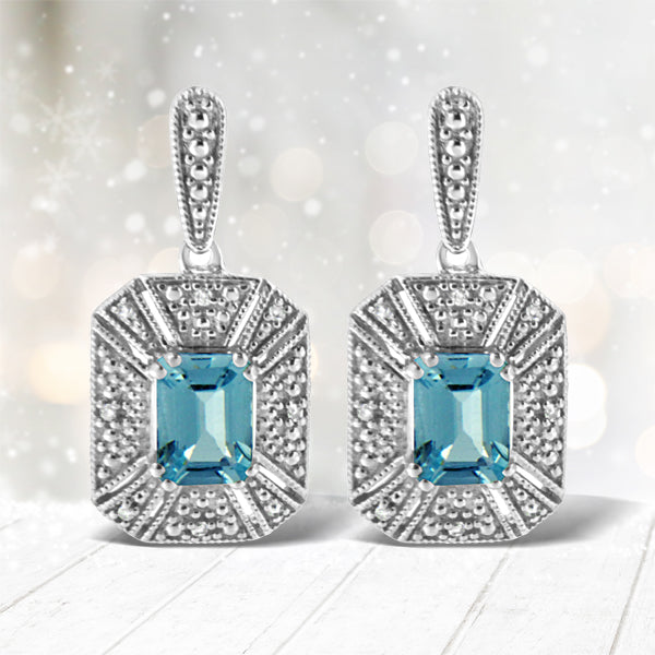 Bids.com .925 Sterling Silver 7x5MM Emerald Shape Blue Topaz and Diamond Accent Art Deco Halo Style Drop and Dangle Earrings (I-J Color, I1-I2 Clarity) Earrings