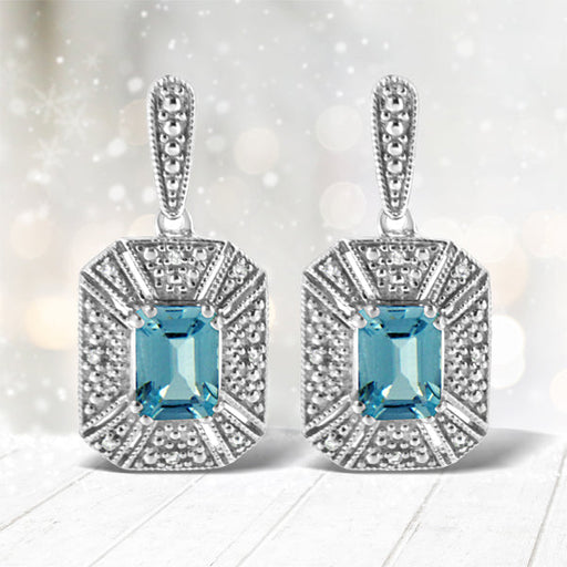 Bids.com .925 Sterling Silver 7x5MM Emerald Shape Blue Topaz and Diamond Accent Art Deco Halo Style Drop and Dangle Earrings (I-J Color, I1-I2 Clarity) Earrings