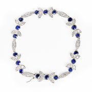 Bids.com 18K White Gold 1 3/4 Cttw Diamond and 3x3mm Round Blue Sapphire Gemstone Floral Link Bracelet (G-H Color, SI1-SI2 Clarity) - Size 7" Bracelets