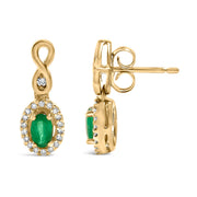 Bids.com 10K Yellow Gold Oval Cut Green Emerald 5x3 mm and 1/7 Cttw Round Diamond Dangle Earrings Earrings