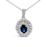 Bids.com 14K White Gold Oval Blue Sapphire and 3/4 Cttw Diamond Halo Pendant Necklace Necklaces
