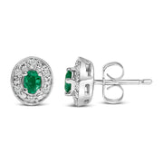 Bids.com 14K White Gold Oval Green Emerald and 1/10 Cttw Diamond Halo Stud Earrings  (I-J Color, I1-I2 Clarity) Earrings