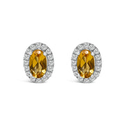 Bids.com 10K White Gold 5x3 MM Oval Purple Amethyst and Diamond Halo Stud Earrings (I-J Color, I1-I2 Clarity) Earrings