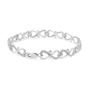 Bids.com .925 Sterling Silver 1/3 Cttw Round-Cut Diamond Double Heart Infinity Link 7.25" Bracelet (H-I Color, I3 Clarity) Bracelets
