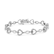 Bids.com .925 Sterling Silver 1/4 Cttw Round-Cut Diamond Alternating Heart and Leaf Link Bracelet (I-J Color, I3 Clarity) - Size 7.25" Bracelets