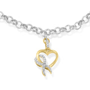 Bids.com 10K Yellow Gold 1/10 Cttw Diamond Awareness Ribbon & Heart Charm on 7" .925 Sterling Silver Rolo Bracelet (H-I Color, I1-I2 Clarity) Bracelets
