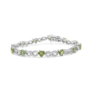 Bids.com .925 Sterling Silver 1.00 Cttw Diamond and 4.00mm Lab Created Green Heart-Shaped Peridot Infinity Link Bracelet (I-J Color, I2-I3 Clarity) - 7.25" Bracelets