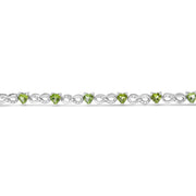 Bids.com .925 Sterling Silver 1.00 Cttw Diamond and 4.00mm Lab Created Green Heart-Shaped Peridot Infinity Link Bracelet (I-J Color, I2-I3 Clarity) - 7.25" Bracelets