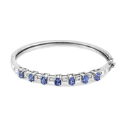 Bids.com 14K White Gold 5 MM Oval Blue Tanzanite and 1/4 Cttw Diamond Bangle (H-I Color, VS2-SI1 Clarity) - Fits wrists up to 7 1/2 Inches Bracelets