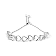 Bids.com .925 Sterling Silver 1/10 Cttw Diamond Heart Link Bolo Bracelet (I-J Color, I2-I3 Clarity) Bracelets