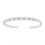 Bids.com .925 Sterling Silver 1/4 Cttw Diamond Rondelle Graduated Ball Bead Cuff Bangle Bracelet (I-J color, I2-I3 clarity) - Fits wrists up to 7 1/2 inches Bracelets