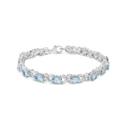 Bids.com .925 Sterling Silver 16.0 Cttw Oval Blue Topaz and Diamond Accent Tennis X Link Bracelet (I-J Color, I1-I2 Clarity) - Size 7" Inch Bracelets