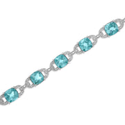 Bids.com .925 Sterling Silver 7x7 mm Cushion Cut Blue Topaz and 1/20 cttw Round Cut Diamond Fashion Tennis Bracelet (I-J Color, I1-I2 Clarity) - 7" Bracelets