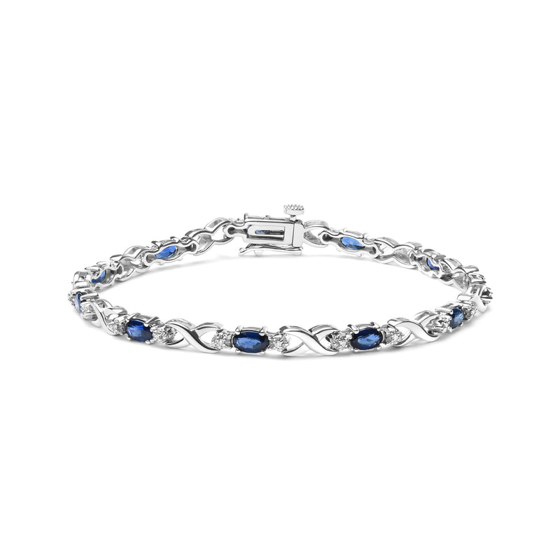 Bids.com 10K White Gold 5x4mm Oval Sapphire Gemstone and 1/10 Cttw Diamond Prong Set "X" Link Bracelet - Size 7" (H-I Color, SI1-SI2 Clarity) Bracelets