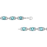 Bids.com .925 Sterling Silver 7x7 mm Cushion Cut Blue Topaz and 1/20 cttw Round Cut Diamond Fashion Tennis Bracelet (I-J Color, I1-I2 Clarity) - 7" Bracelets