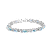 Bids.com .925 Sterling Silver Oval Blue Topaz Diamond Butterfly Link Bracelet (I-J Color, I1-I2 Clarity) - Size 7" Inches Bracelets