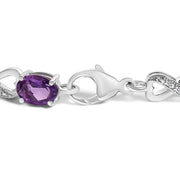 Bids.com .925 Sterling Silver Oval Purple Amethyst and Diamond Infinity Link Bracelet (I-J Color, I1-I2 Clarity) - 7" Inches Bracelets