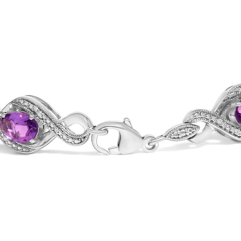 Bids.com .925 Sterling Silver 1/10 Cttw Natural Round Diamond and 7X5MM Oval Amethyst Cross Tennis Bracelet (I-J Color, I1-I2 Clarity) - 7" Bracelets