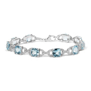 Bids.com .925 Sterling Silver 7x7 mm Cushion Cut Blue Topaz and 1/20 cttw Round Cut Diamond Fashion Tennis Bracelet (I-J Color, I1-I2 Clarity) - 7" Bracelets