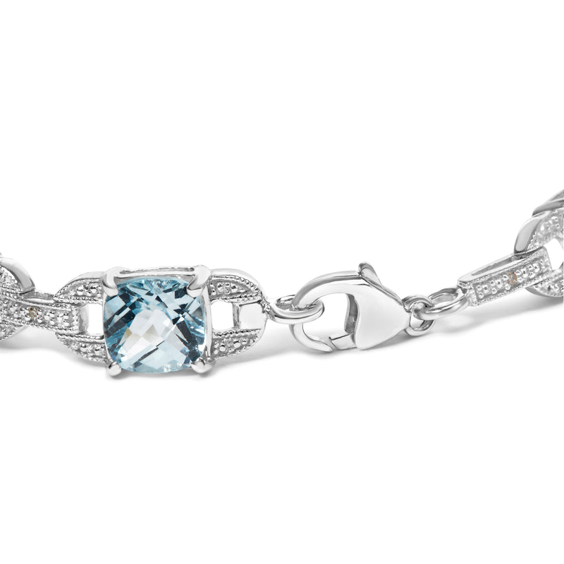 Bids.com .925 Sterling Silver 7x7 mm Cushion Cut Blue Topaz and 1/20 cttw Round Cut Diamond Fashion Tennis Bracelet (I-J Color, I1-I2 Clarity) - 7" Bracelets