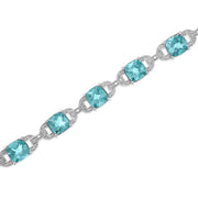 Bids.com .925 Sterling Silver 7x7 mm Cushion Cut Blue Topaz and 1/20 cttw Round Cut Diamond Fashion Tennis Bracelet (I-J Color, I1-I2 Clarity) - 7" Bracelets