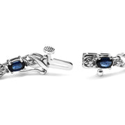 Bids.com 10K White Gold 5x4mm Oval Sapphire Gemstone and 1/10 Cttw Diamond Prong Set "X" Link Bracelet - Size 7" (H-I Color, SI1-SI2 Clarity) Bracelets