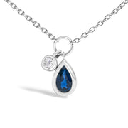 Bids.com 10K White Gold 6x4 mm Pear Blue Sapphire and Diamond  Accent Charm Pendant Necklace - 18" Inches Necklaces