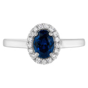 Bids.com 10K White Gold 1/5 Cttw Round Diamond and Prong Set 7MM Created Blue Sapphire Halo Cocktail Ring (H-I Color, I1-I2 Clarity) - Size 7 Rings