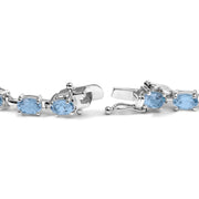 Bids.com .925 Sterling Silver 11.0 Cttw Oval Shaped Created Light Blue Topaz Link Bracelet - 7 inch Bracelets