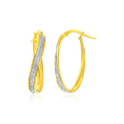 Bids.com 14k Two-Tone Gold Oval Hoop Twist Glittery Earrings Earrings