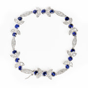 Bids.com 18K White Gold 1 3/4 Cttw Diamond and 3x3mm Round Blue Sapphire Gemstone Floral Link Bracelet (G-H Color, SI1-SI2 Clarity) - Size 7" Bracelets