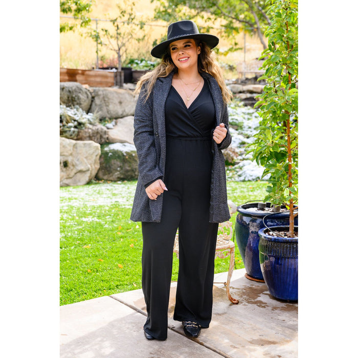 Onward & Upward Faux Wrap Jumpsuit In Black