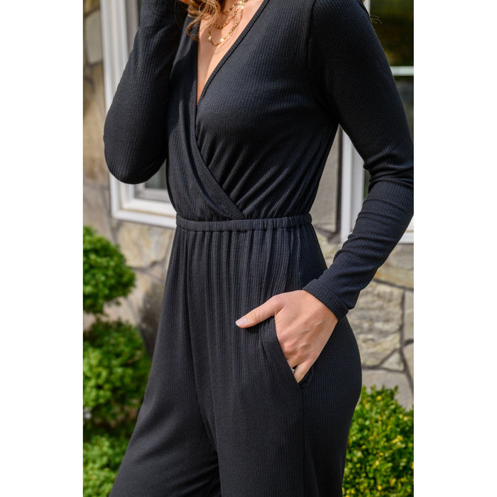 Onward & Upward Faux Wrap Jumpsuit In Black