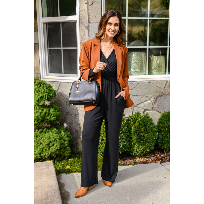 Onward & Upward Faux Wrap Jumpsuit In Black