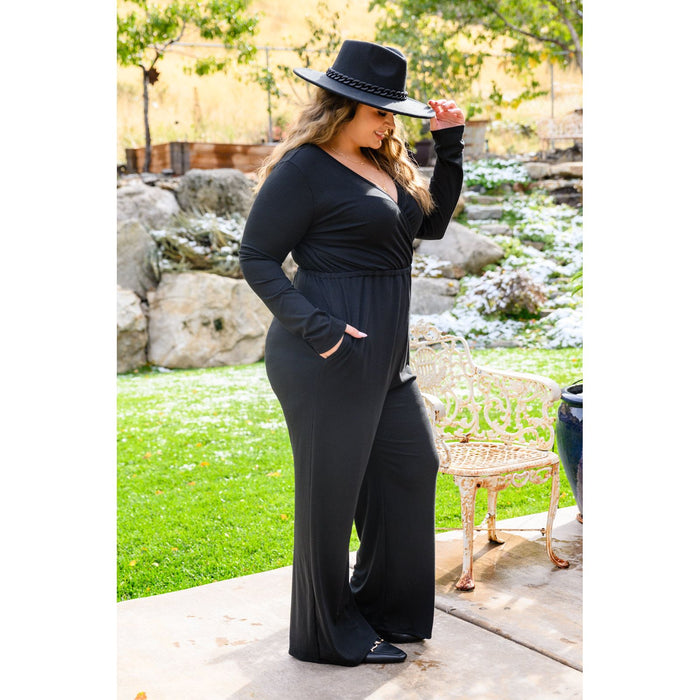 Onward & Upward Faux Wrap Jumpsuit In Black