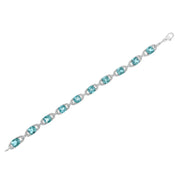 Bids.com .925 Sterling Silver 7x7 mm Cushion Cut Blue Topaz and 1/20 cttw Round Cut Diamond Fashion Tennis Bracelet (I-J Color, I1-I2 Clarity) - 7" Bracelets