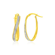 Bids.com 14k Two-Tone Gold Oval Hoop Twist Glittery Earrings Earrings